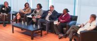 A panel discussion on a stage